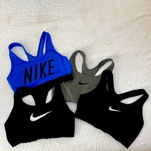 Four Size medium Nike Sports Bras